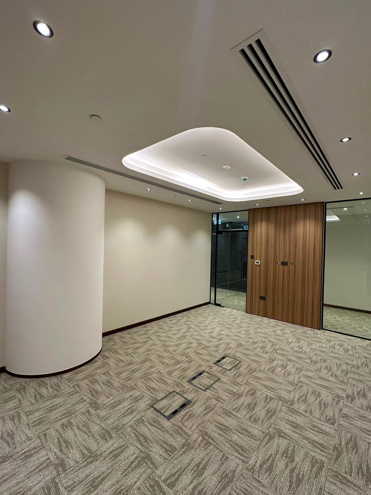 Circular column, wood door and glazed partition